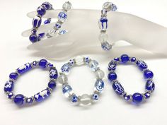 "Hanukkah Chanukah Bracelets, Jewish Blue White Glass Beaded Bracelets, Hamsa Star Of David, Christmas Birthday Gift For Women, Pack of 6 Material: glass beads, plastic spacer Size: 7.50\" should fit most woman small to medium wrist  Quantity: 6 pcs  Color: Clear and Blue Design on the beads: Chai, Star of David, Hamsa Beaded Bracelet - Bracelet For Women - Gift For Her - Jewish Glass Beads Stretch Bracelet-  Stretch bracelet around 7.5 inch in length should fit most medium wrist. Thread using J Beautiful Compliments, Hamsa Bracelet, Birthday Gift For Women, Chakra Bracelet, Bracelets Jewelry, Glass Beaded Bracelets, Christmas Birthday Gifts, Star Of David, Women Artisans