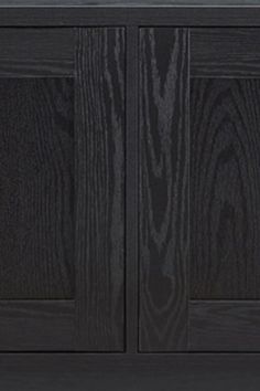 a black cabinet with two doors and drawers