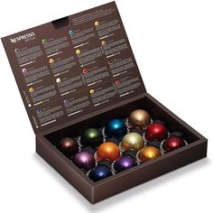 a box filled with lots of different colored ornaments