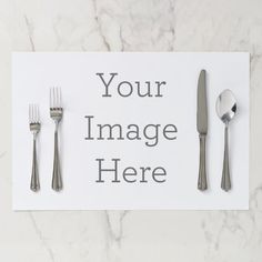 a place setting with silverware and a white card that says, your image here