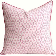 a pink and white pillow on a white background