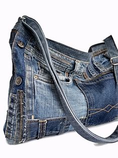 a purse made out of old jeans is shown on the white background with a strap