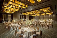 a large banquet hall with tables and chairs