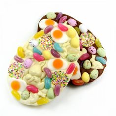 two pieces of chocolate covered with candies and eggs