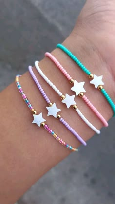 four different bracelets with stars on them