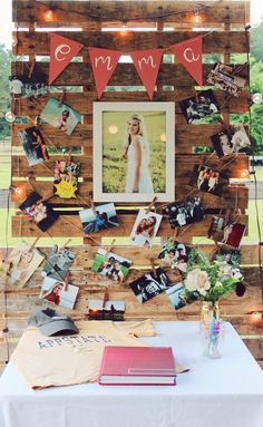 a table topped with pictures and photos under lights