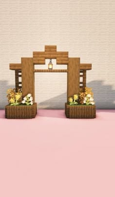 two small wooden planters with flowers in them