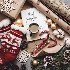 an assortment of christmas decorations and gifts on a table