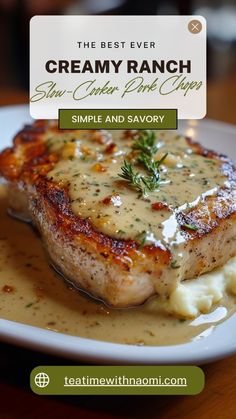 a white plate topped with meat covered in gravy