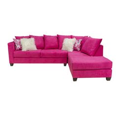 a pink couch with pillows on it