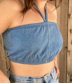 "These are handmade and reworked from old denim made into the perfect bubble tube tops that can be worn as halters or have the straps tucked in and worn as tubes. They best fit a small/ medium and fit from 24\"-30\" and are shown on a size medium model. The perfect summer wardrobe essential to pair with vintage Levis and prairie skirts. This listing is for one reworked bubble tube ✨(15)" Cropped Denim Blue Vest For Summer, Fitted Denim Bandeau Top, Fitted Denim Halter Neck Top, Stretch Medium Wash Denim Vest For Summer, Summer Stretch Denim Vest In Medium Wash, Summer Denim Stretch Tube Top, Stretch Denim Tube Top For Summer, Summer Stretch Denim Tube Top, Casual Denim Halter Neck Top