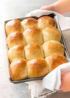 a pan filled with rolls sitting on top of a counter