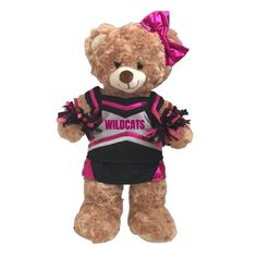 a brown teddy bear wearing a cheerleader outfit with pink bows on it's head