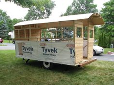 a tiny house is being built in the grass