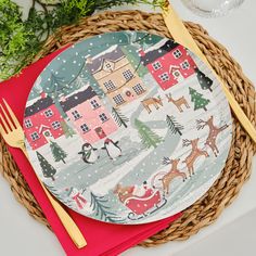 a christmas themed place setting with red napkins and silverware on a wicker basket