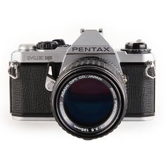 the pentax camera is shown with its lens up to it's left side