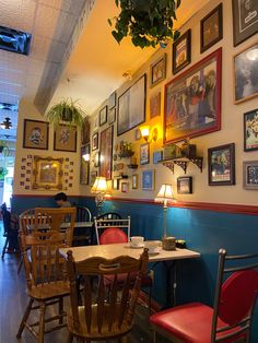 a dining room filled with tables and chairs next to pictures on the wall above them