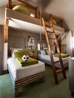 a bedroom with bunk beds and a ladder to the top level above it is a green carpeted floor