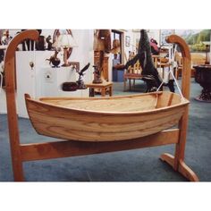 a wooden boat is on display in a shop