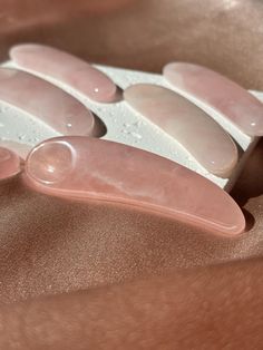 Transform your skincare routine into a luxurious ritual with our exquisite Rose Quartz Cream Spatula. Meticulously carved from natural rose Quartz, this versatile tool is more than just a moisturizer scooper - it's a symbol of self-care. Its smooth, cool surface gently glides over your skin, making it perfect for applying creams and serums with precision and ease. But that's not all - the unique shape and texture of this spatula also make it ideal for delicate under-eye treatments, serving as a Skincare Spoon, Wellness Tools, Gua Sha Tools, Beauty Regimen, Massage Tools, Gua Sha, Beauty Spa, Skincare Routine, Rose Quartz