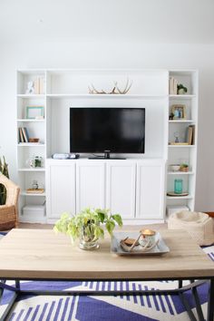 the living room is clean and ready to be used for tvs, bookshelves, and more