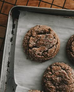 four cookies are on a baking sheet and ready to be baked in the oven,