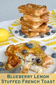 blueberry lemon stuffed french toast is on a yellow and white striped tablecloth, next to a stack of pancakes