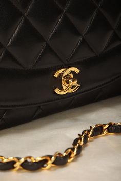 CONDITION: VERY GOOD VINTAGE and card. Crafted from the finest lambskin leather, this medium Diana bag features a sleek and streamlined design with a stunning 24K gold plated chain and hardware. The black color is versatile and perfect for any occasion, while the signature Chanel diamond quilted pattern adds a touch of luxury and elegance. The spacious interior of this bag features multiple compartments, including a zip pocket, allowing you to keep all of your essentials organized and easily accessible. The adjustable chain strap can be as a single or double strap, giving you the flexibility to wear it as a shoulder bag or crossbody. Named after one of the most iconic woman in history, this bag truly carries on the history and elegance of Princess Diana. Crafted in 1994-1996 Please note: V Woman In History, Girl Backpacks School, Quilted Pattern, Streamlined Design, Backpack Tote Bag, Louis Vuitton Shoes, Dior Shoes, Iconic Women, Diamond Quilt