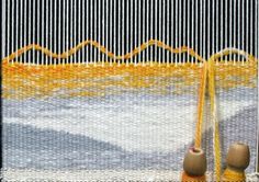 two vases sitting in front of a weaving machine