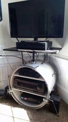 a television sitting on top of a metal stand