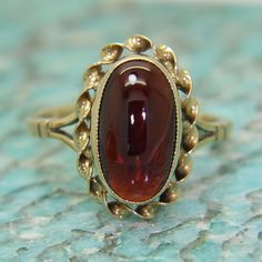 Vintage garnet cabochon 9ct yellow gold ring. Fully hallmarked for 9ct gold assayed in Birmingham in 1976. In good vintage condition. This will arrive in a ring box. An attractive ring! Weight 3.32g. Size O, US size 7 1/4. Garnet measures 13.5mm by 7mm. Victorian Rings Vintage, Vintage Ring Box, Cabochon Ruby, Victorian Rings, Garnet Jewelry, Yellow Gold Ring, Multi Stone Ring, Ruby Ring, Ring Vintage