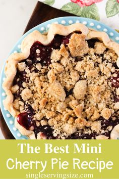 the best mini cherry pie recipe on a blue and white plate with flowers in the background