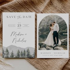 save the date cards with an image of a bride and groom on top of rocks