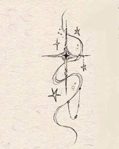 a drawing of an anchor and stars on paper