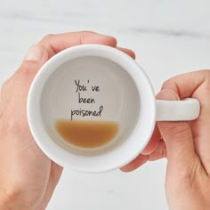 a person holding a coffee mug with the words will you be my maid of honor?