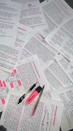 several pieces of paper with scissors and pens on them next to some pink marker markers