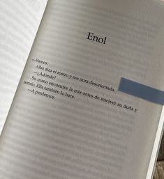 an open book with the word enrol written on it's page and a piece of blue tape sticking out