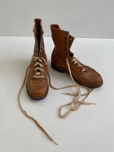 Vintage 1970s Bearfoot Work Boots Leather Free Shipping These boots are cool! They are small, I believe they are a men's or youth 4, which would make them a woman's size 6. I wear a women's 8, and I could pull them on, but barely, way too small. The markings on the inside are on suede which makes it hard to read. They are in good vintage condition with no major flaws. They have a Moc toe and are very sturdy. The heel was reinforced with a BF Goodrich heel. The color is sort of a rusty or gold colored brown. Inside sole measures 9.5" outside, toe to heel 10 1/8" mens/youth size 4  women's size 6