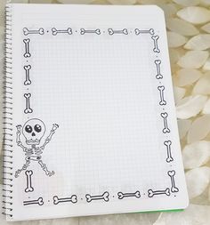 a notebook with a skull and bones drawn on it