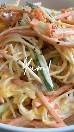 a white bowl filled with pasta and veggies