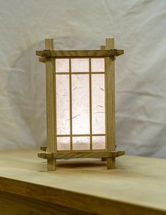 a wooden table with a small light on it