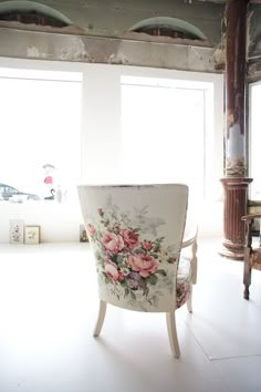 a white chair with flowers painted on it