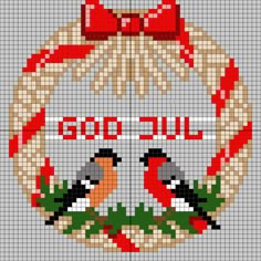 a cross stitch christmas ornament with two birds and a wreath on the front