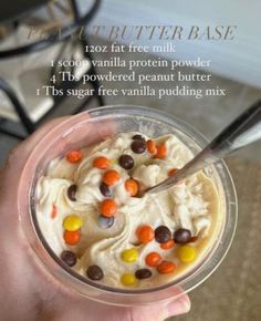 a person is holding a cup filled with pudding and candy candies, while the text below reads treat butter base