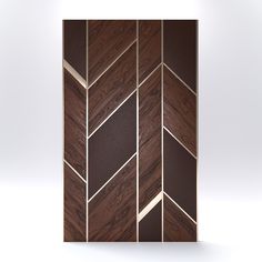 a wooden paneled wall with brown and gold designs on it's sides, against a white background