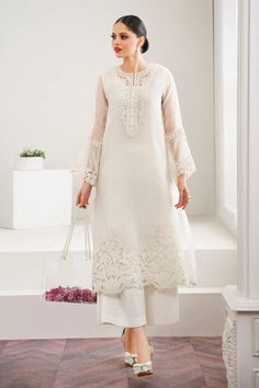 EMBROIDERED ORGANZA UF-526 (PRE-ORDER)The EMBROIDERED ORGANZA UF-526 features a beautifully embroidered front and neckline patch, a plain organza back, and a delicate embroidered border along the front and sleeve edges. It also includes a digital printed organza dupatta with intricate embroidery and a dyed silk trouser for a complete and elegant outfit.3 PIECEEmbroidered organza front (1 yard)Plain organza back (1.25 yard)Embroidered organza neckline patch (1 pc)Embroidered organza front border (1 pc)Plain organza sleeves (0.75 yard)Embroidered organza sleeves border (1.08 yard)Embroidered digital printed organza dupatta (2.5 yard)Embroidered organza dupatta side border (10 yard)Dyed silk trouser (2.70 yard)Dispatch time: 5-8 weeks Organza Suit Sleeves Design, Suit Designs Organza, Organza Suit Designs Latest, Organza Suits Designs, Pakistani Organza Suits, White Organza Suit, Organza Suits Indian, Organza Suit Design, Embroidered Organza Sets For Eid