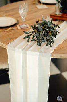 the table is set with place settings and napkins