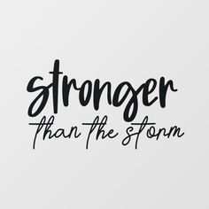 the words,'stronger than the storm'written in black ink