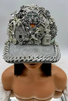 **Introducing the "Fierce Fantasy Junkie Trucker Hat"** Elevate your style with the **Fierce Fantasy Junkie Trucker Hat**--a dazzling masterpiece for those who embrace boldness and flair. This exceptional piece transforms the classic trucker hat into a glamorous expression of individuality. Each **Fierce Fantasy Junkie Trucker Hat** is a unique creation, lavishly adorned with sparkling embellishments and striking design details. These intricate touches add an extravagant flair, ensuring that your hat reflects your personal aesthetic. With customizable charm options, you can design a piece that perfectly aligns with your style, whether you seek an eye-catching statement or a more harmonious blend.  What sets this hat apart is its commitment to exclusivity--no two hats are ever alike. Each p Funny Hat Ideas, Hat Diy Ideas, Custom Hat Ideas, Hat Charms, Bling Hats, Statement Hat, Mad Hat, Hat Bar, Dope Hats