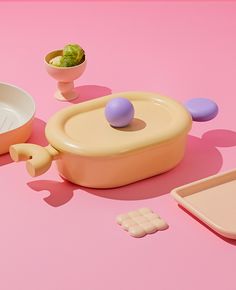 an assortment of food items on a pink surface